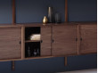 Mid modern scandinavian shelving system in walnut, model Royal System by Poul Cadovius, new edition. 