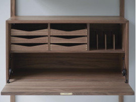 Mid modern scandinavian shelving system in walnut, model Royal System by Poul Cadovius, new edition. 
