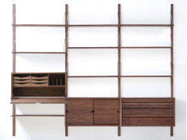 Mid modern scandinavian shelving system in walnut, model Royal System by Poul Cadovius, new edition. 