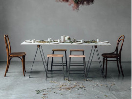 Adam stool.   Rectangular leather seat and raw steel structure.  H50 cm. 
