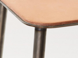 Adam stool.   Rectangular leather seat and raw steel structure.  H50 cm. 