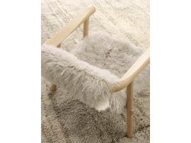 Altay Armchair. Natural upholstered in white Mongolian goatskin. 