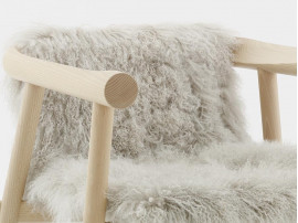 Altay Armchair. Natural upholstered in white Mongolian goatskin. 