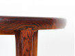 Extendable circular dining table in Rio rosewood