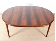 Extendable circular dining table in Rio rosewood