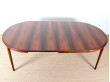Extendable circular dining table in Rio rosewood