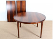 Extendable circular dining table in Rio rosewood