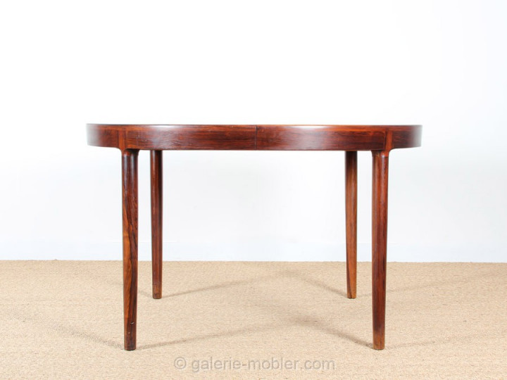 Scandinavian round dining table in rosewood 6/10 seats.