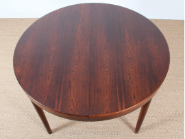 Scandinavian round dining table in rosewood 6/10 seats.