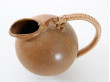 Scandinavian pottery : pitcher with a rattan handle, designed by Arne Bang