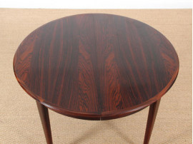 Scandinavian round dining table in Rio rosewood