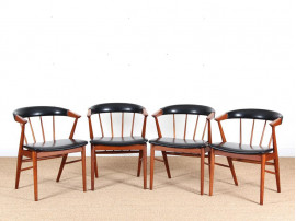 Suite de 4 fauteuils scandinaves en teck et simili cuir
