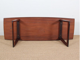 Mid-Century  modern large  coffe table in Rio rosewood with sledge legs.