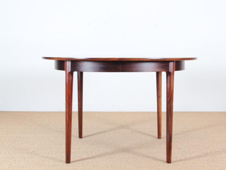 Mid-Century Modern danish extendable round dining table in Rio rosewood. 