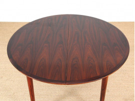 Mid-Century Modern danish extendable round dining table in Rio rosewood. 