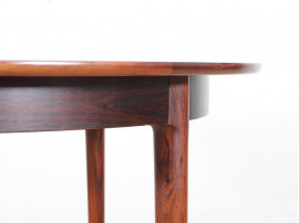 Mid-Century Modern danish extendable round dining table in Rio rosewood. 
