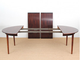 Mid-Century Modern danish extendable round dining table in Rio rosewood. 