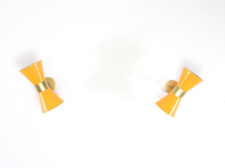 Mid century modern pair of yellow Diabolo wall lamp.