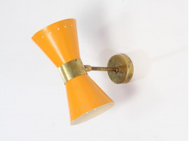 Mid century modern pair of yellow Diabolo wall lamp.