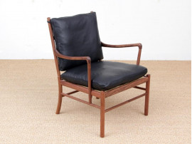 Mid-Century modern scandinavian Colonial arm chair in walnut by Ole Wanscher. New edition