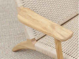 Mid-Century modern scandinavian arm chair in oak model CH 25 by Hans Wegner. New edition