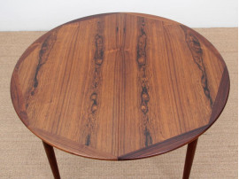 Mid-Century Modern danish extendable round dining table in Rio rosewood. 