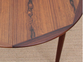 Mid-Century Modern danish extendable round dining table in Rio rosewood. 