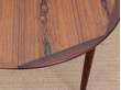 Mid-Century Modern danish extendable round dining table in Rio rosewood. 