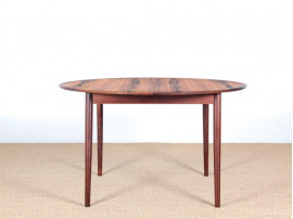 Mid-Century Modern danish extendable round dining table in Rio rosewood. 