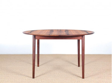 Mid-Century Modern danish extendable round dining table in Rio rosewood. 