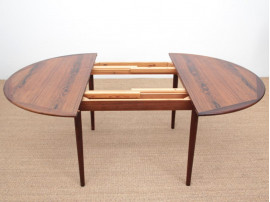 Mid-Century Modern danish extendable round dining table in Rio rosewood. 