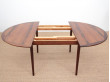 Mid-Century Modern danish extendable round dining table in Rio rosewood. 