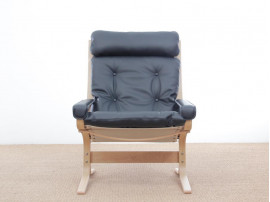 Mid modern century Siesta Classic armchair, hight back by Ingmar Relling. New edition.