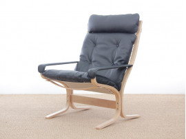 Mid modern century Siesta Classic armchair, hight back by Ingmar Relling. New edition.