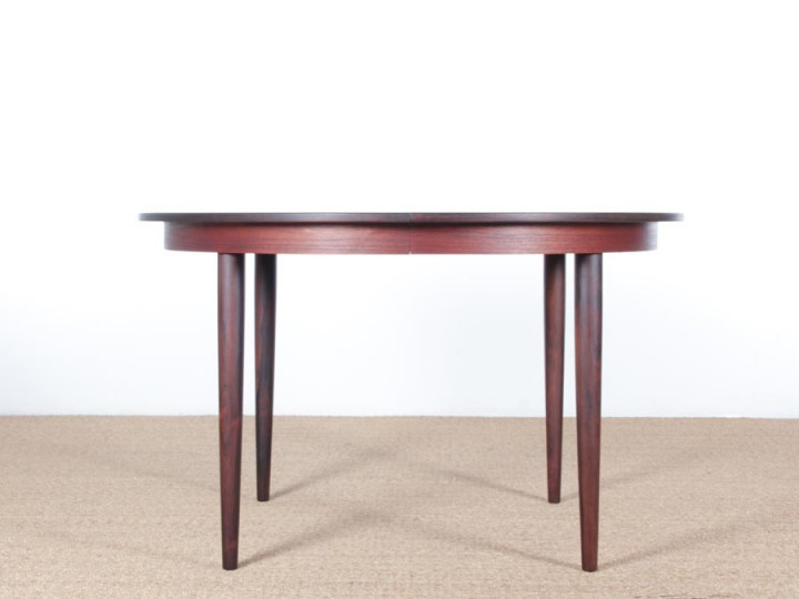 Mid-Century Modern danish extendable round dining table in Rio rosewood. 