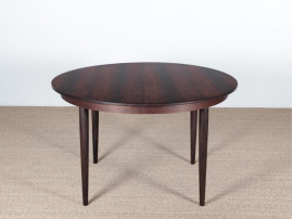 Mid-Century Modern danish extendable round dining table in Rio rosewood. 