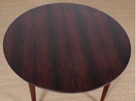 Mid-Century Modern danish extendable round dining table in Rio rosewood. 