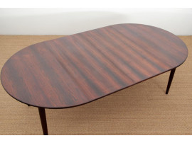 Mid-Century Modern danish extendable round dining table in Rio rosewood. 