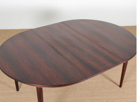 Mid-Century Modern danish extendable round dining table in Rio rosewood. 