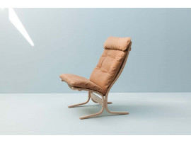 Mid modern century Siesta Classic armchair, hight back by Ingmar Relling. New edition.