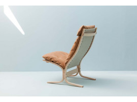 Mid modern century Siesta Classic armchair, hight back by Ingmar Relling. New edition.